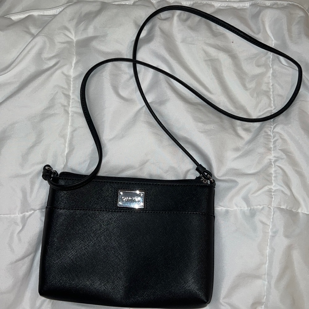 Black Calvin Klein shoulder bag with silver hardware.